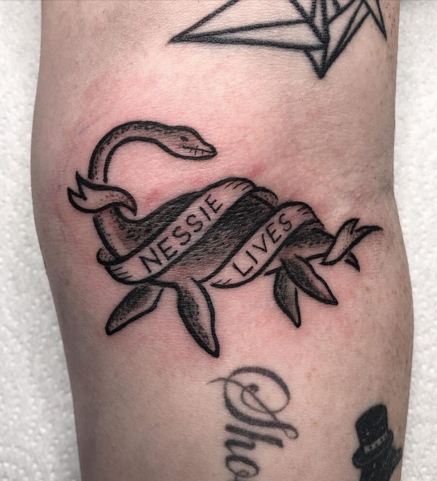 Whimsical Nessie tattoo with inspirational text Tattoo Design