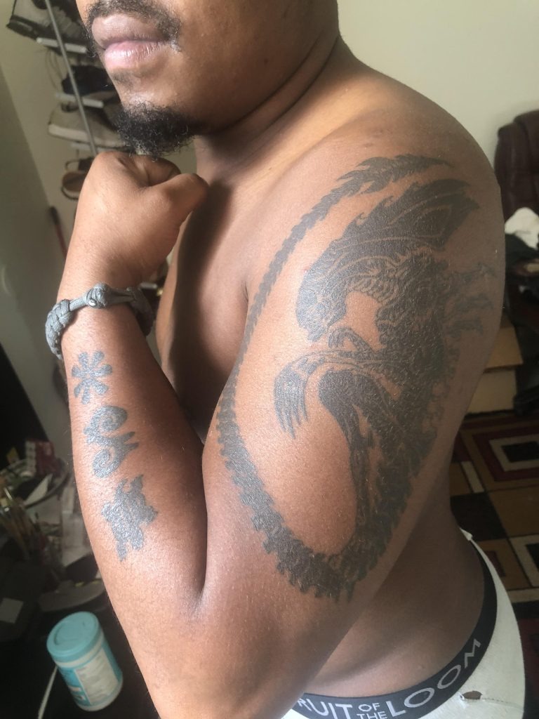 Dragon and Symbolic Forearm Art Tattoo Design