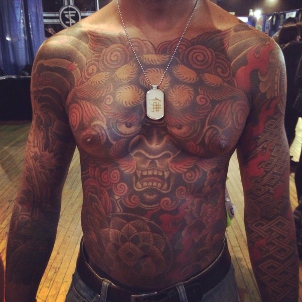 Full Chest and Sleeve - A Masterpiece of Patterns and Imagery Tattoo Design