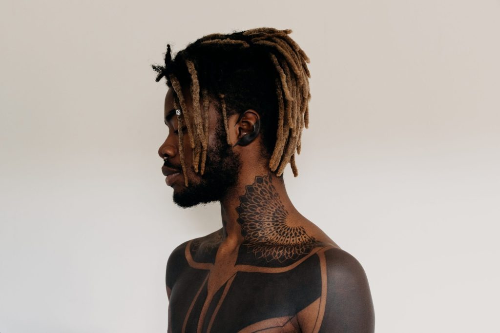Neck and Chest Geometric Art Tattoo Design