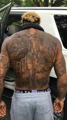 The Urban Landscape of a Back Piece Tattoo Design