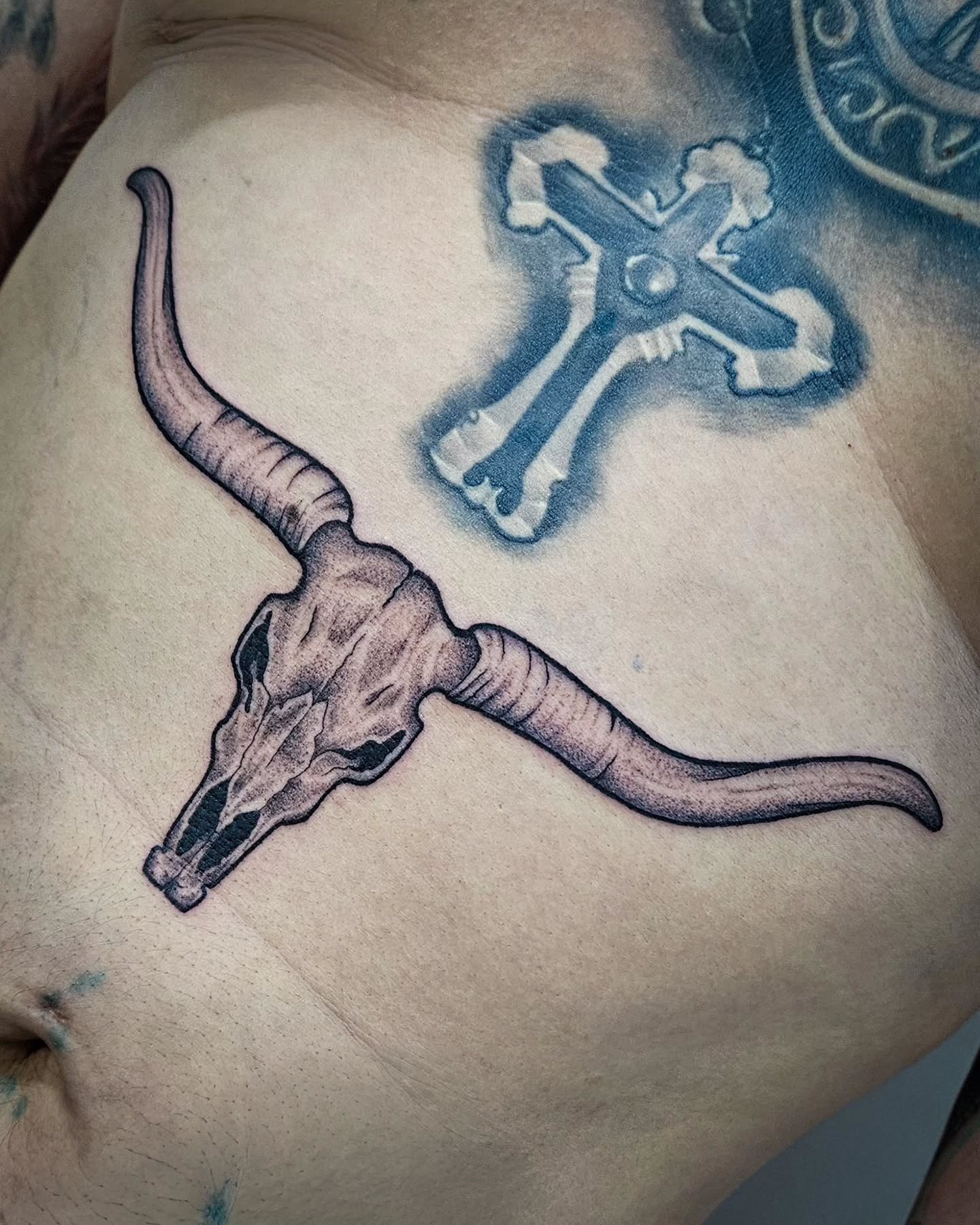 Angled Longhorn Skull Rib Tattoo Tattoo Design