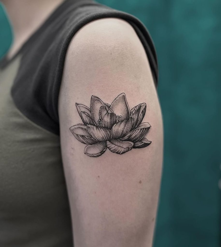 Black and White Lotus Tattoo on the Upper Arm Tattoo Design