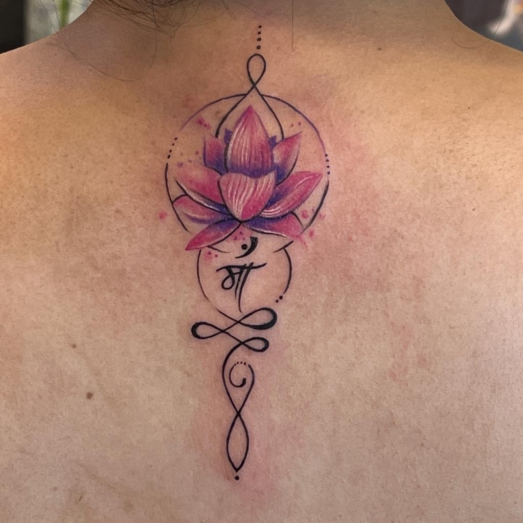 Colorful Sacred Lotus with Spiritual Symbolism Tattoo Design