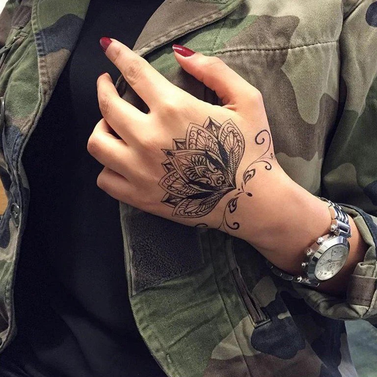 Lotus Tattoo with Ornate Patterns on the Hand Tattoo Design
