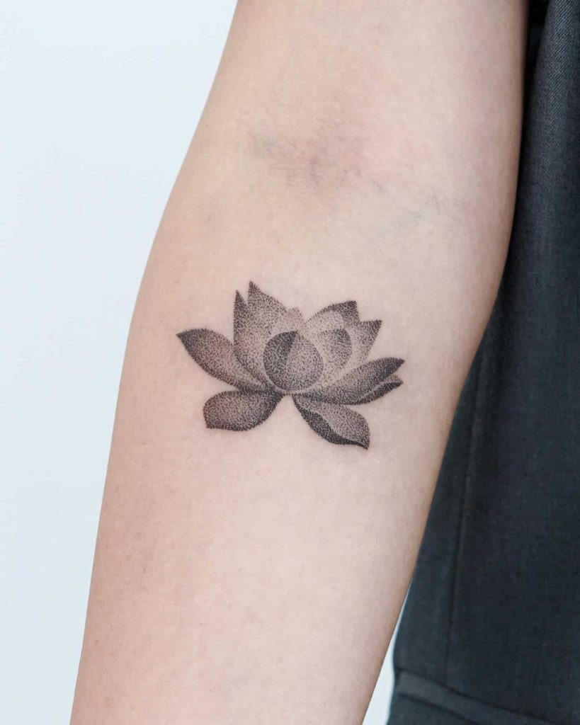 Minimalist Dotwork Lotus on the Forearm Tattoo Design