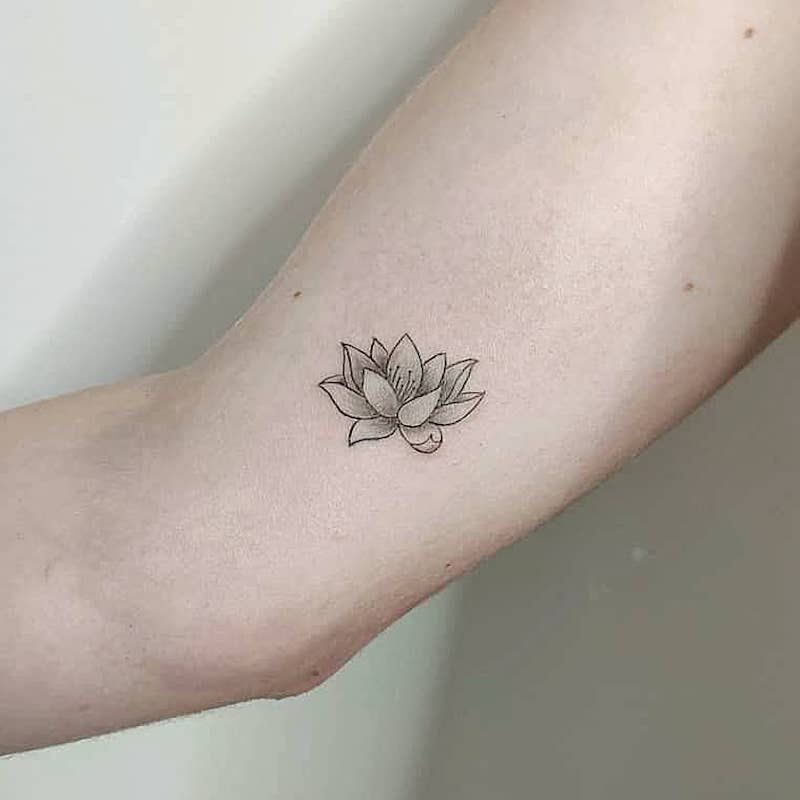 Tiny Black Lotus Tattoo on the Inner Arm Tattoo Design
