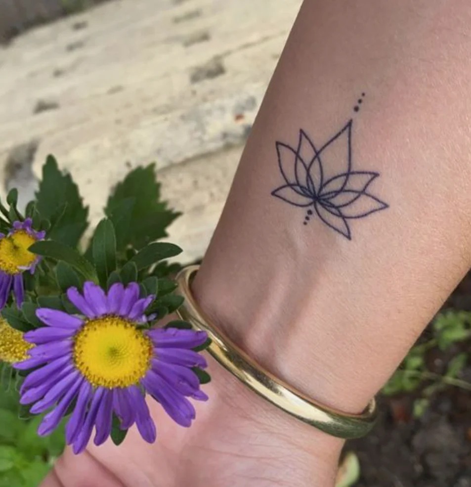 Tiny Minimalist Lotus on the Wrist Tattoo Design