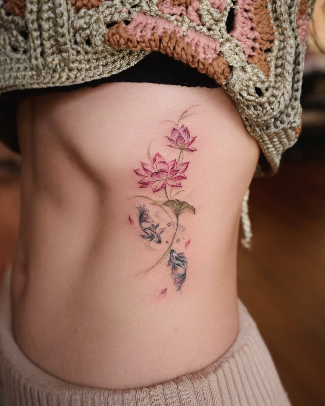 Delicate lotus tattoo with a floral touch Tattoo Design