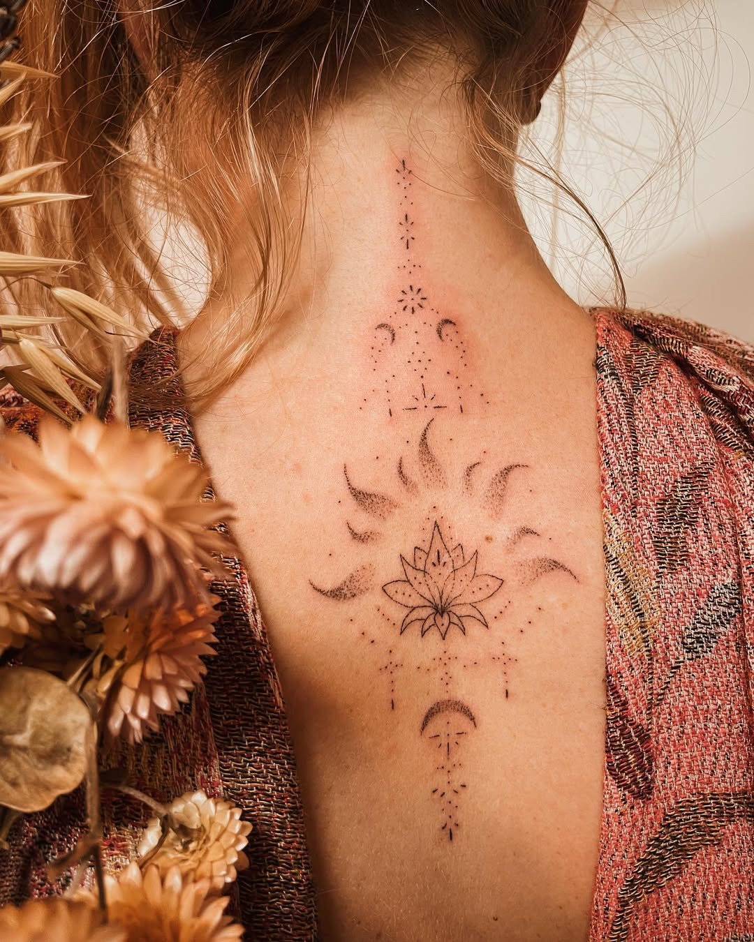 Elegant Back Lotus Tattoo With Mystical Elements Tattoo Design