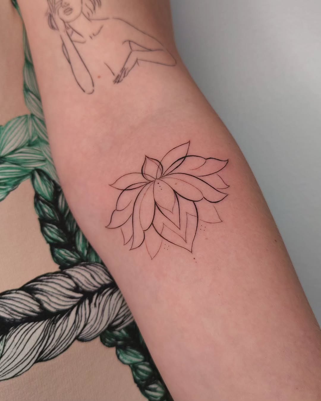 Elegant floral lotus tattoo on the arm Tattoo Design