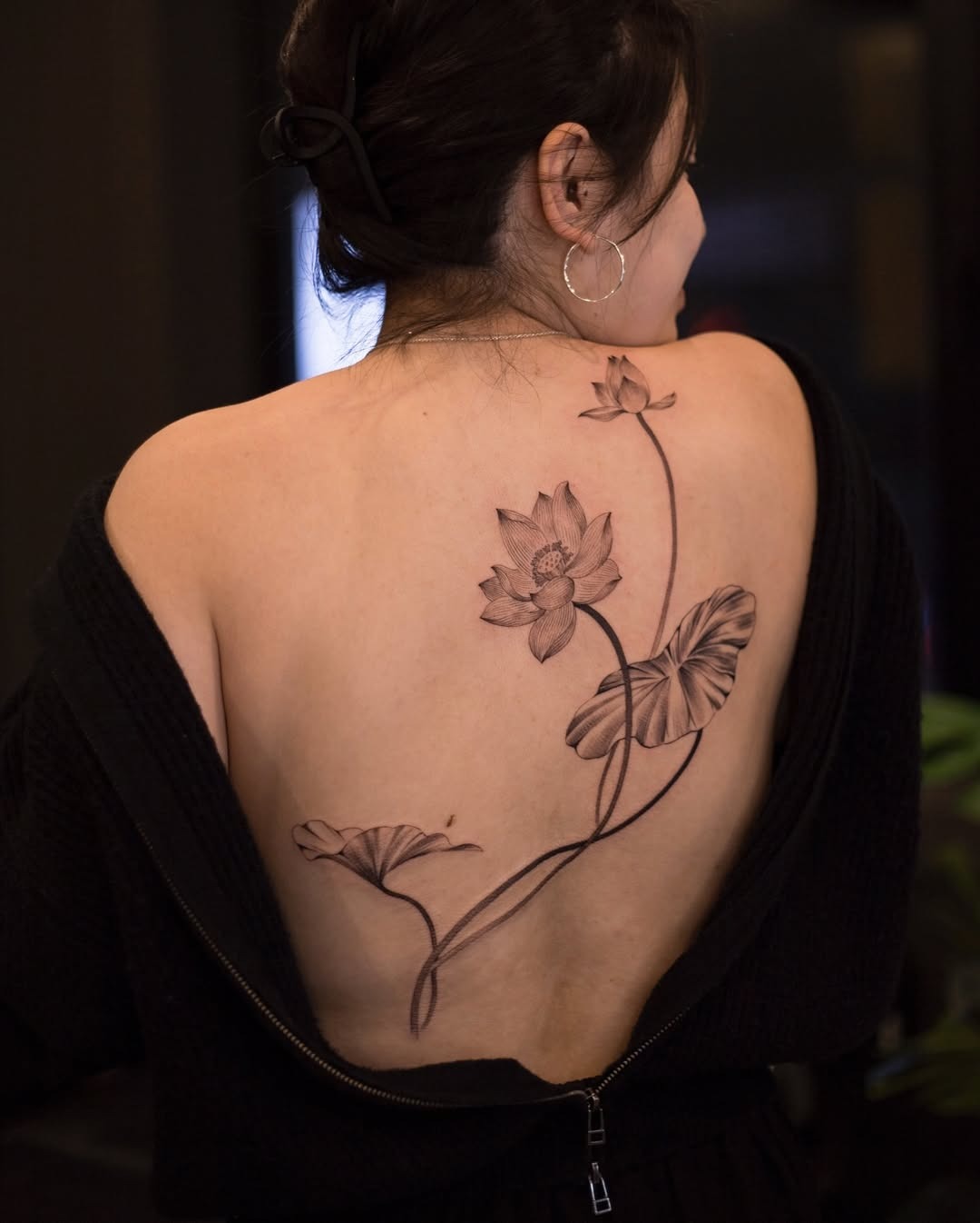 Elegant Lotus Tattoo Gracefully Adorning the Back Tattoo Design