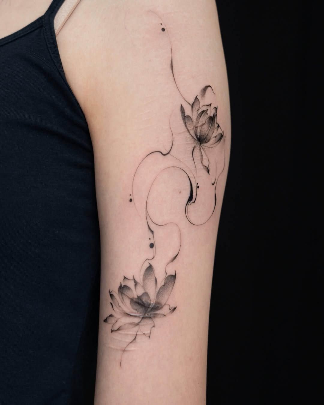 Elegant lotus tattoo with delicate floral details. Tattoo Design