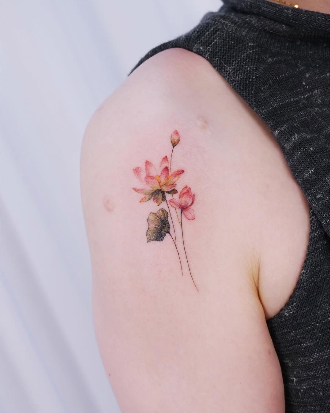 Elegant lotus tattoo with flowing black lines Tattoo Design
