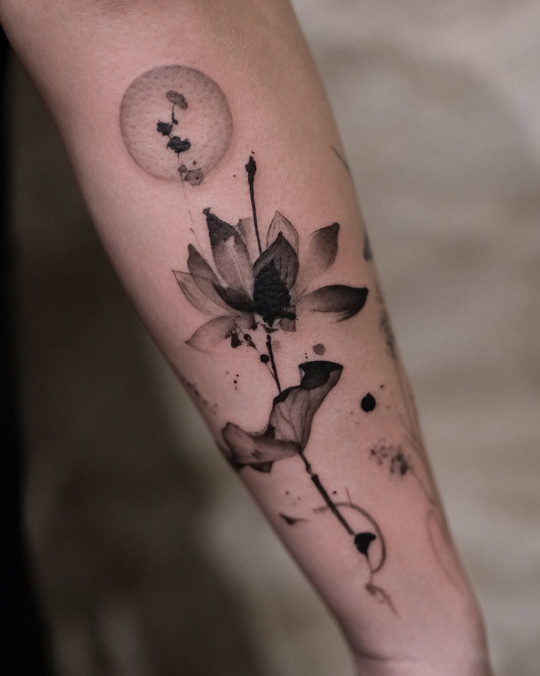 Elegant lotus tattoo with flowing design Tattoo Design