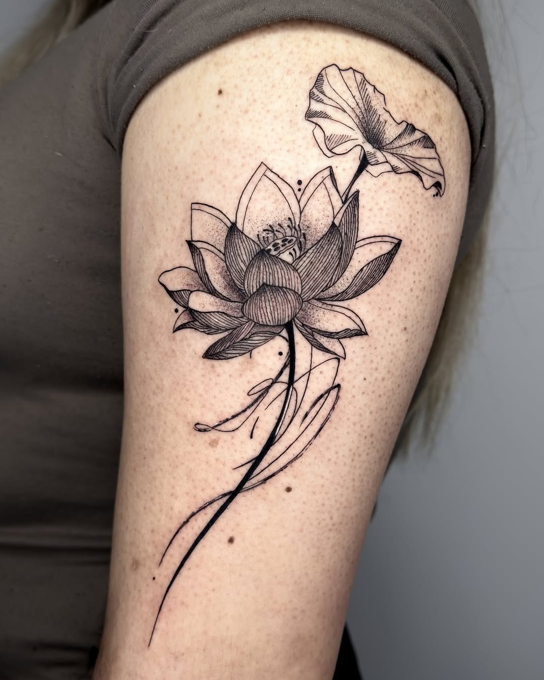 Elegant lotus tattoo with intricate details Tattoo Design