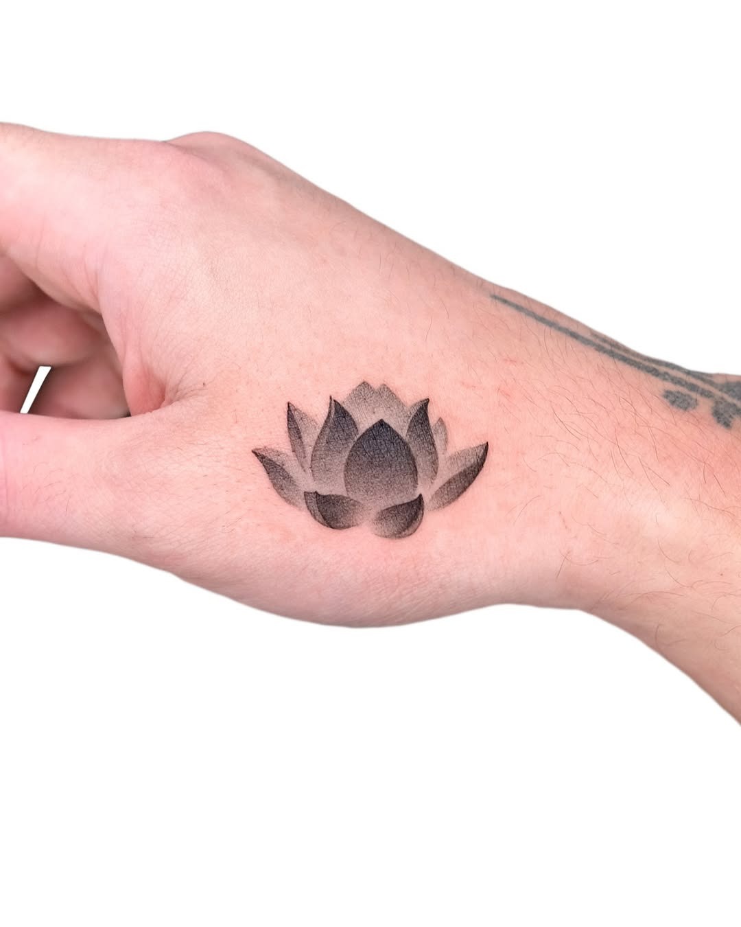 Elegant lotus tattoo with moon accent Tattoo Design