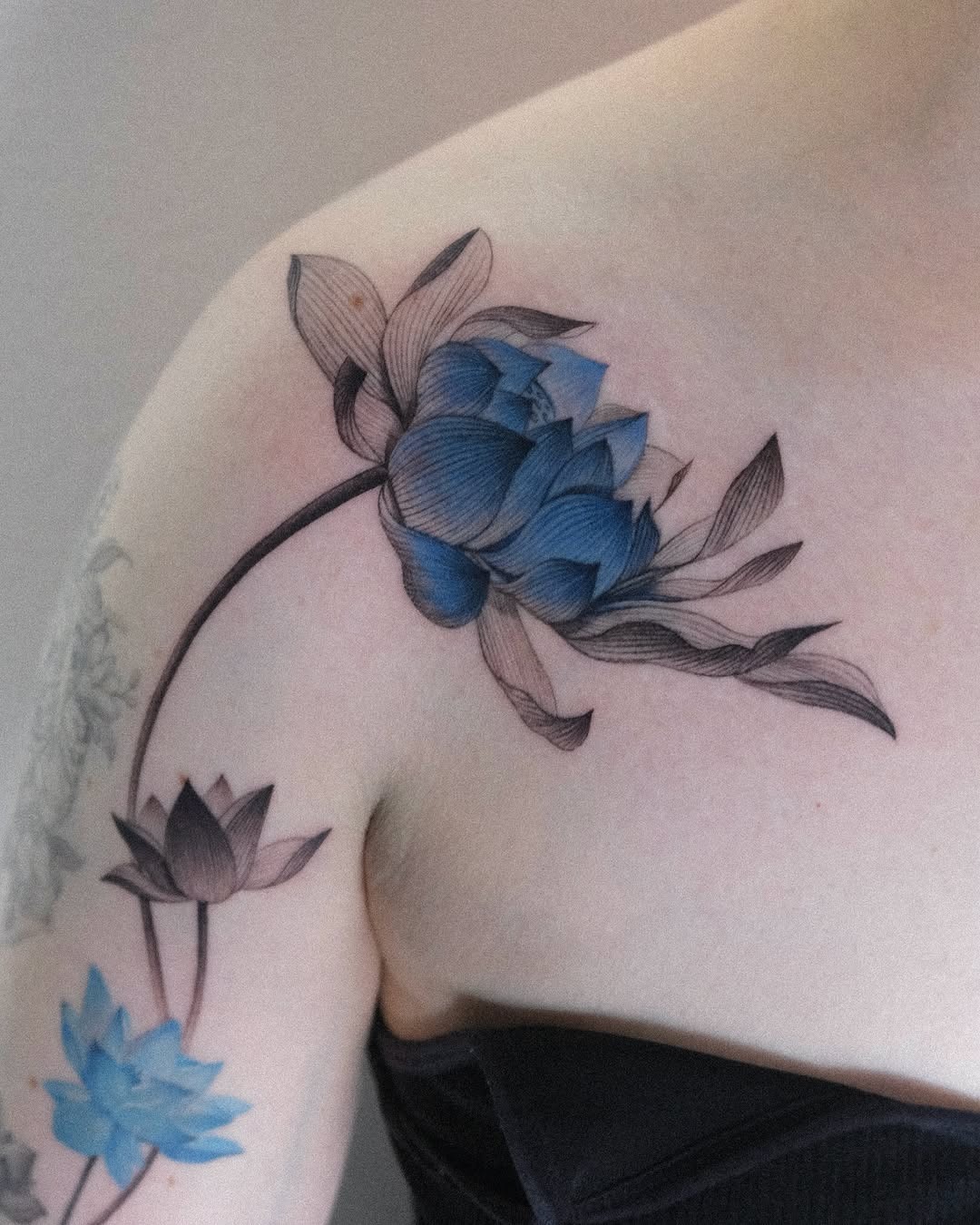 Elegant lotus tattoo with moon and line art Tattoo Design