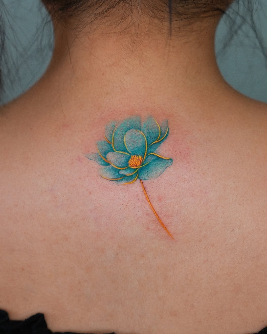 Elegant minimalist lotus tattoo on the forearm Tattoo Design