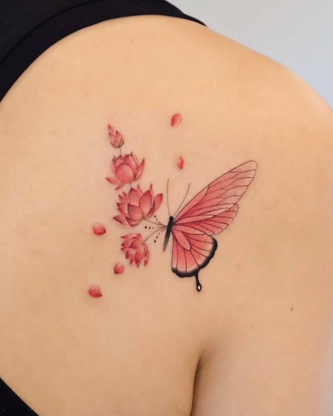 Elegant pink lotus tattoo on thigh area Tattoo Design