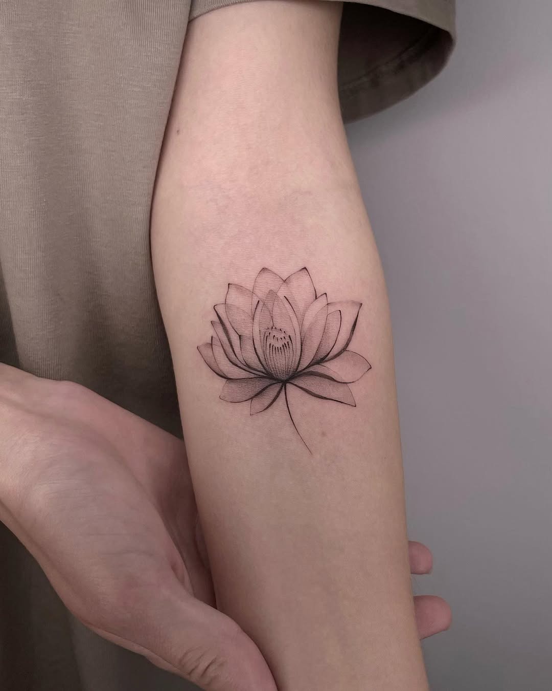 Stylish lotus tattoo with spiritual symbols Tattoo Design