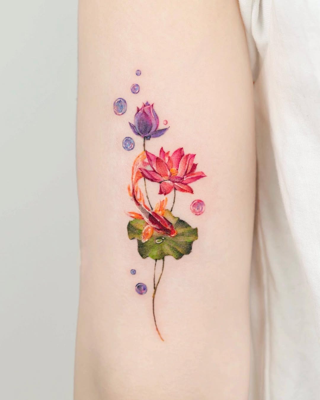 Vibrant blue and purple lotus flower tattoo Tattoo Design