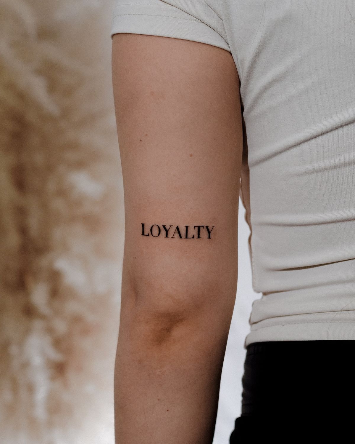 Bold Script Loyalty Tattoo on Calf Tattoo Design