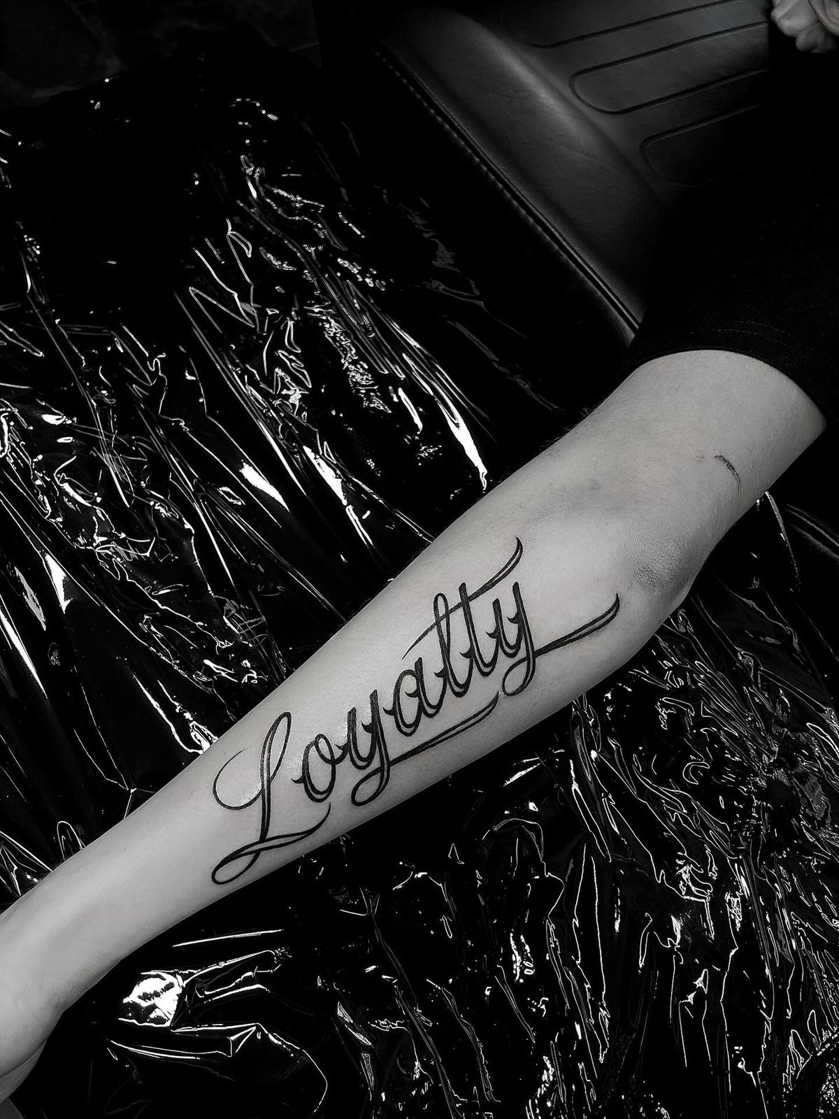 Gothic-Inspired Loyalty Chest Tattoo Tattoo Design