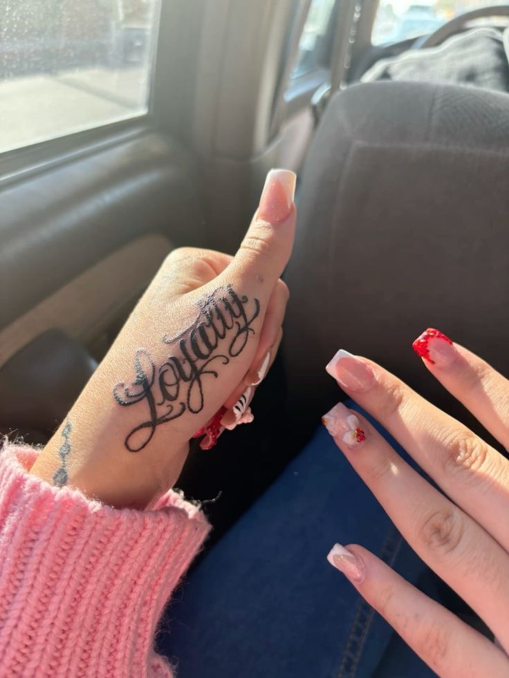 Loyalty Tattoo on Forearm in Script Tattoo Design
