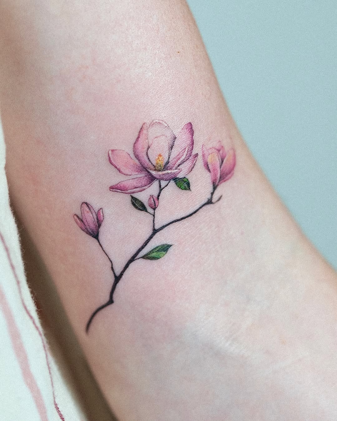 Delicate Magnolia Tattoo on Ankle Tattoo Design