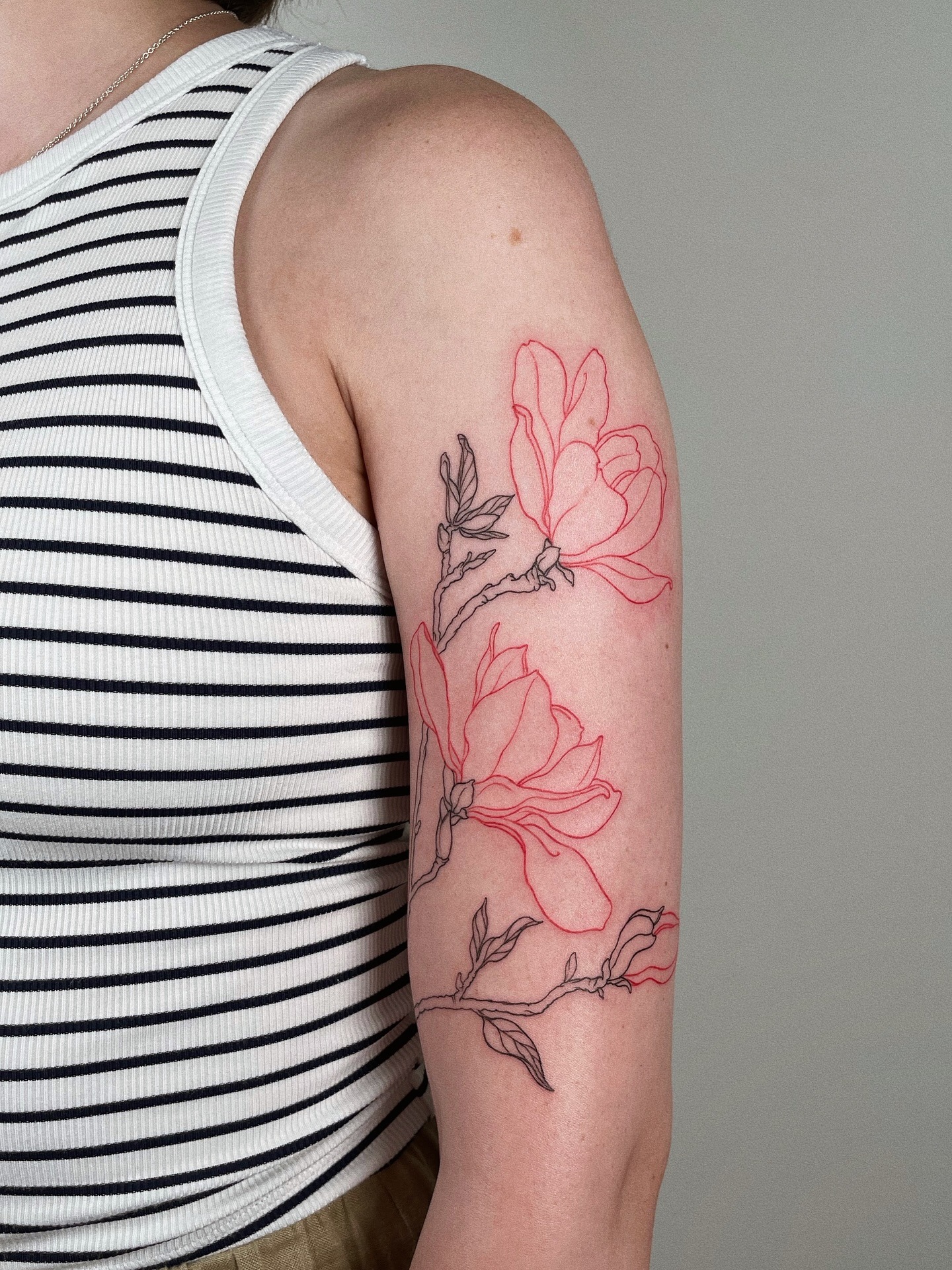 Delicate outline magnolia tattoo on arm Tattoo Design
