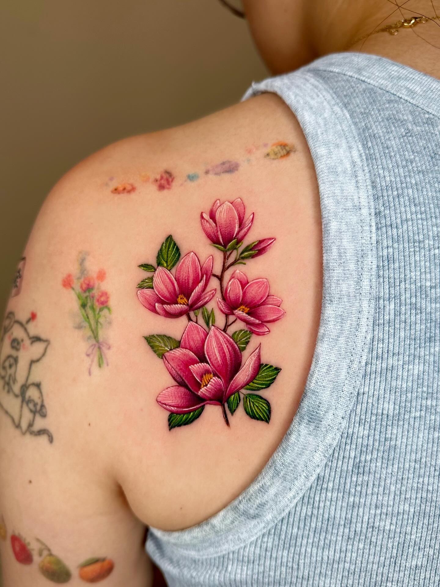 Elegant magnolia flower tattoo on the shoulder Tattoo Design