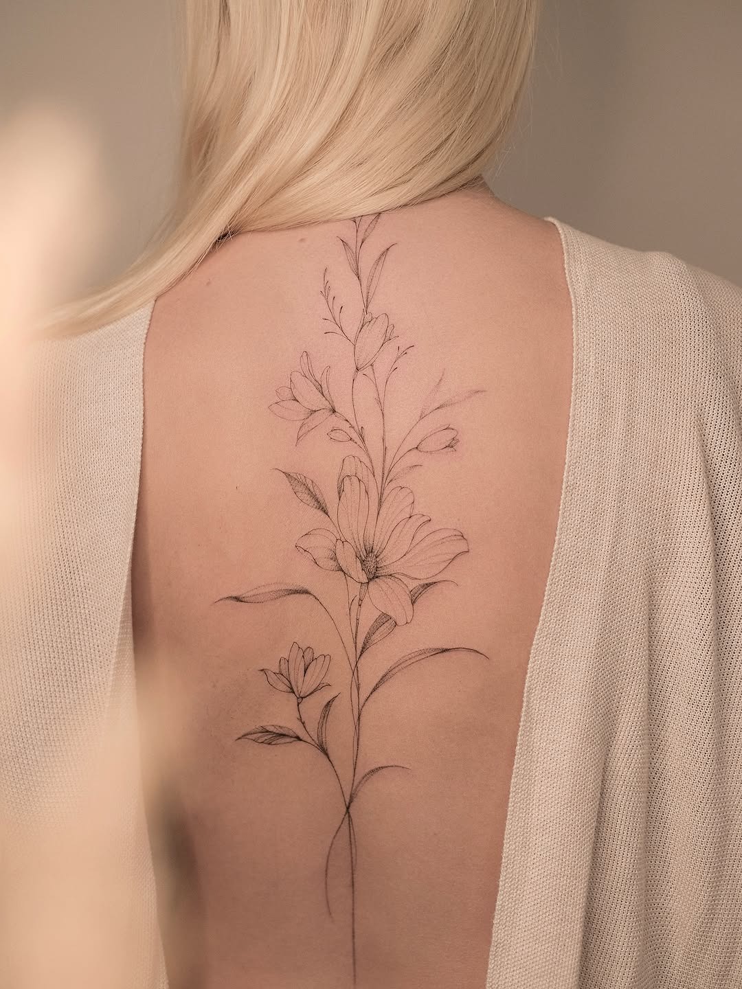 Elegant Magnolia Tattoo Captured on a Back Tattoo Design