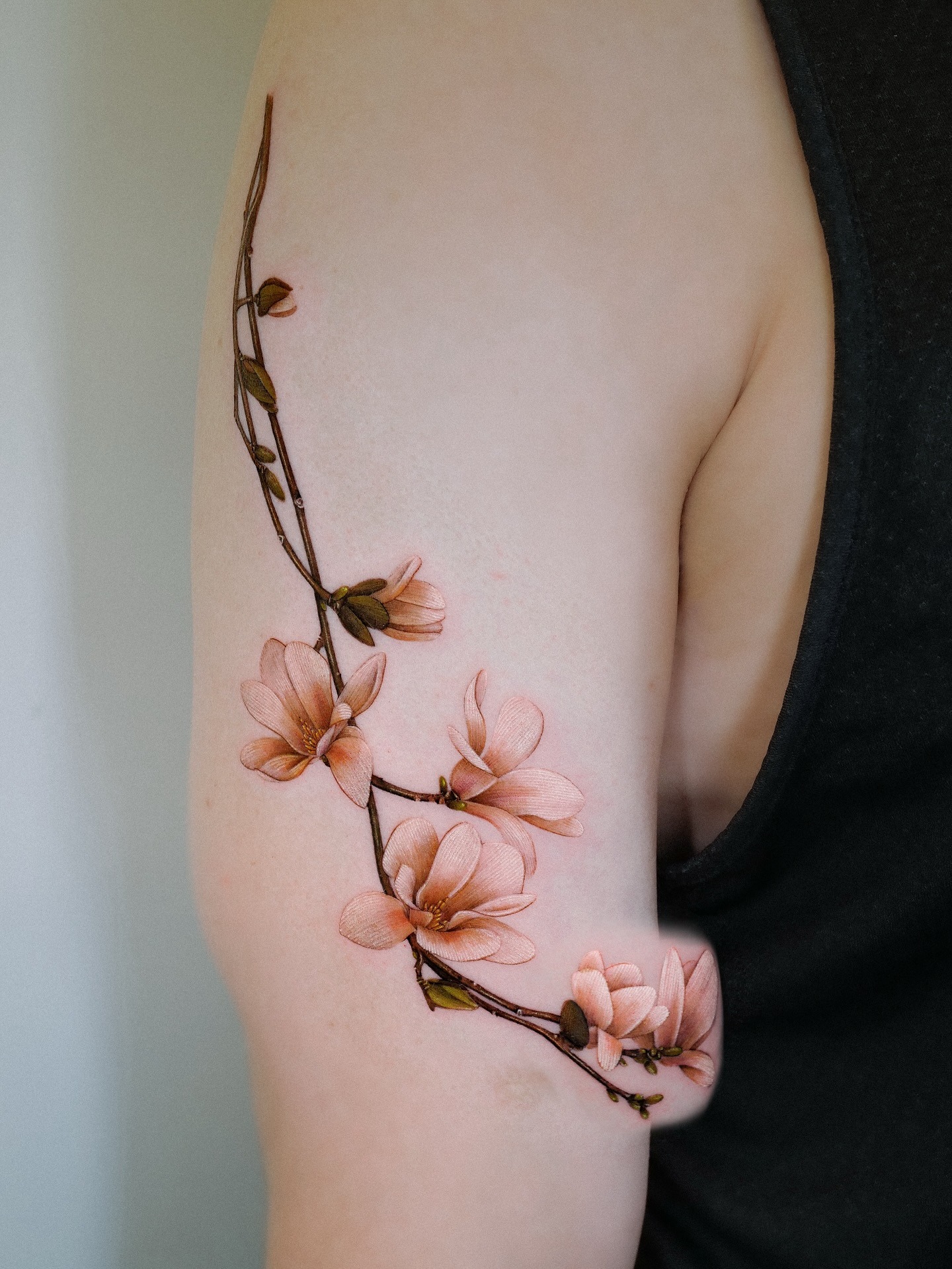 Elegant Magnolia Tattoo on the Arm Tattoo Design