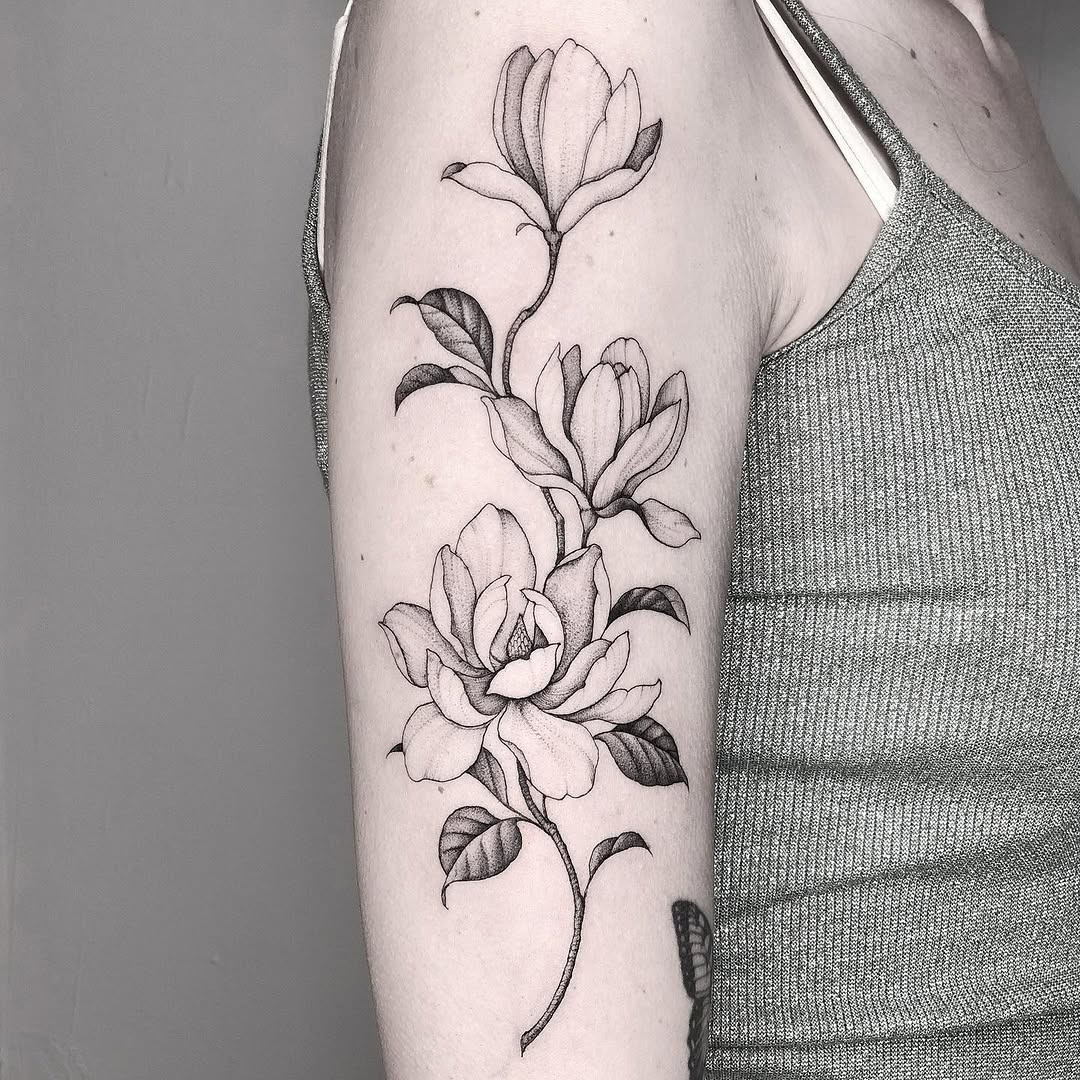 Elegant magnolia tattoo on the arm Tattoo Design