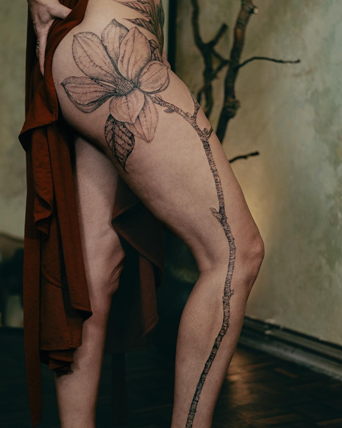 Elegant Magnolia Tattoo on Woman's Leg Tattoo Design