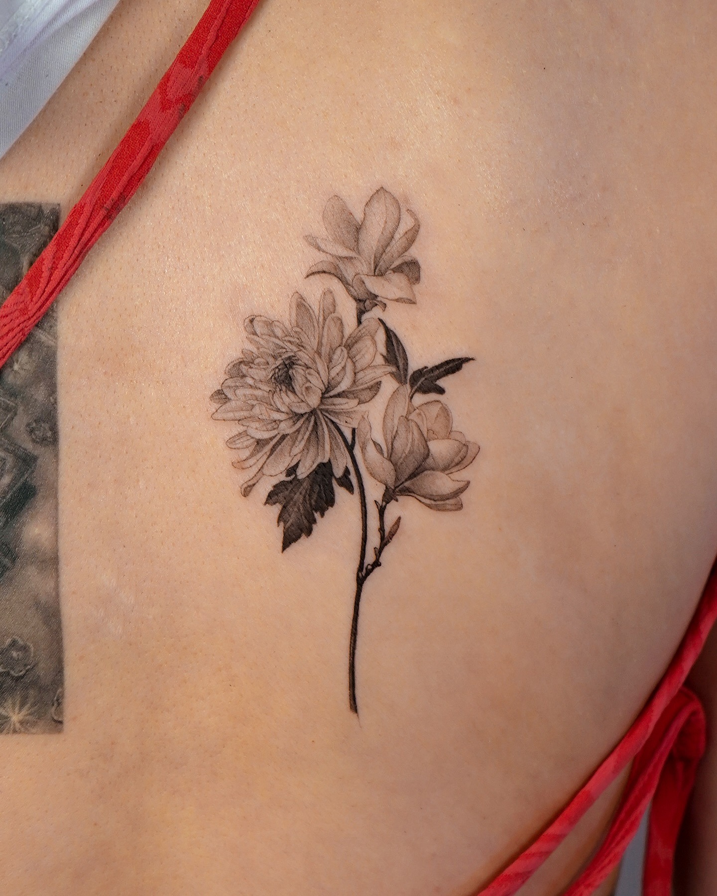 Elegant magnolia tattoo showcasing fine details Tattoo Design