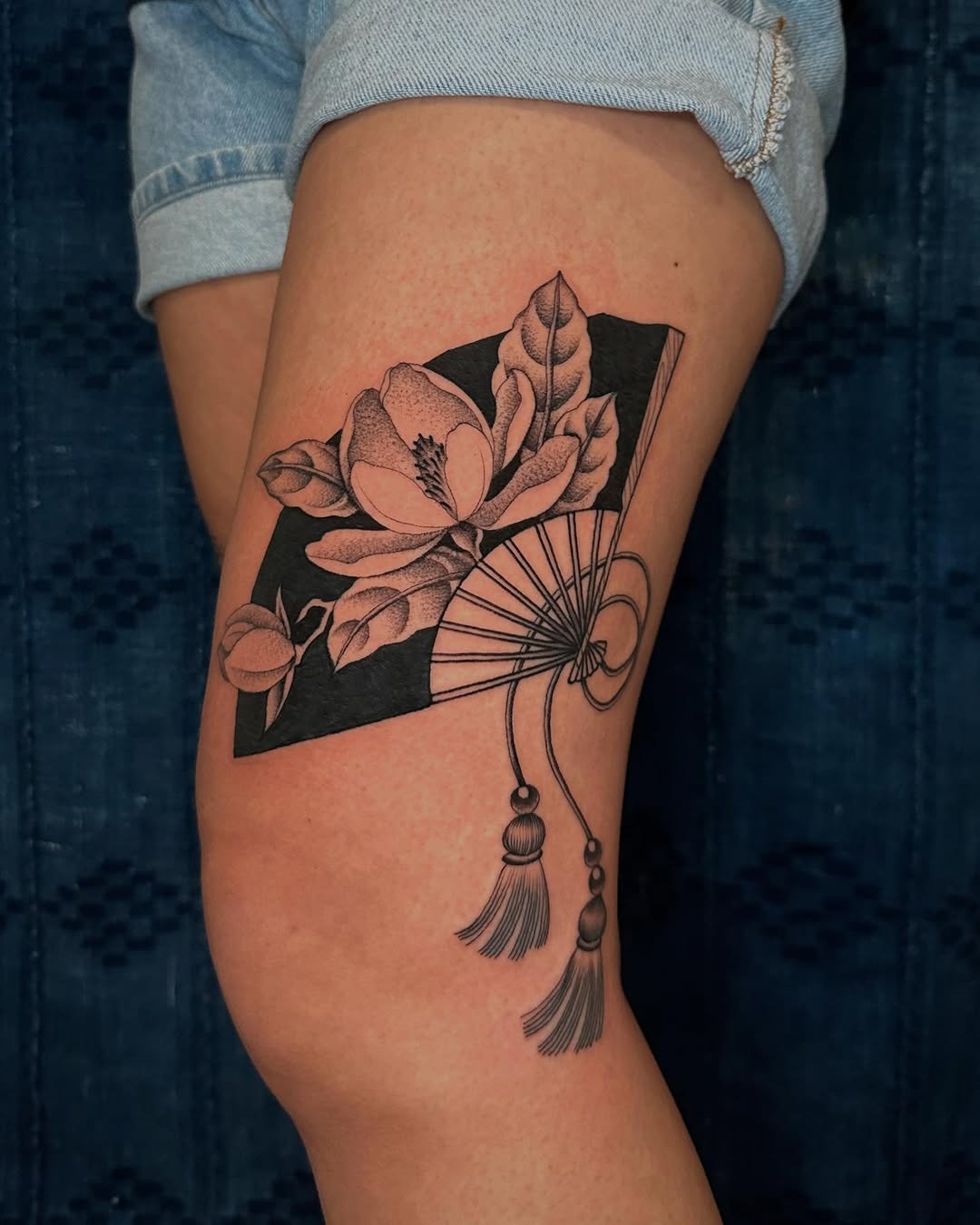 Elegant magnolia tattoo with fan motif Tattoo Design