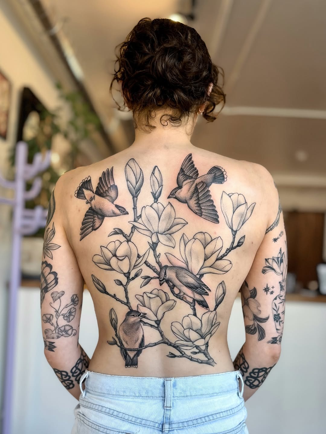Stunning back tattoo with flora and fauna Tattoo Design