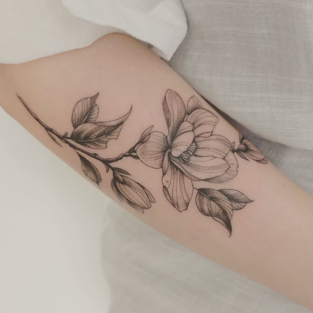 Stunning Magnolia Tattoo with Delicate Lines Tattoo Design