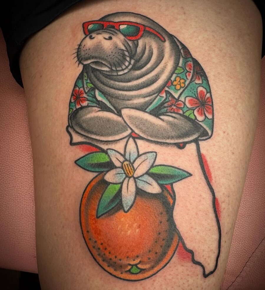 This manatee tattoo features a whimsical design, showing the gentle creature wearing trendy sunglasses.