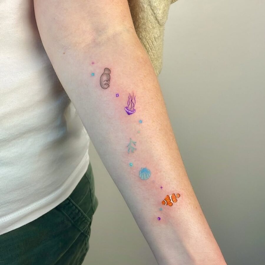 This tattoo design features a whimsical manatee alongside sea creatures.