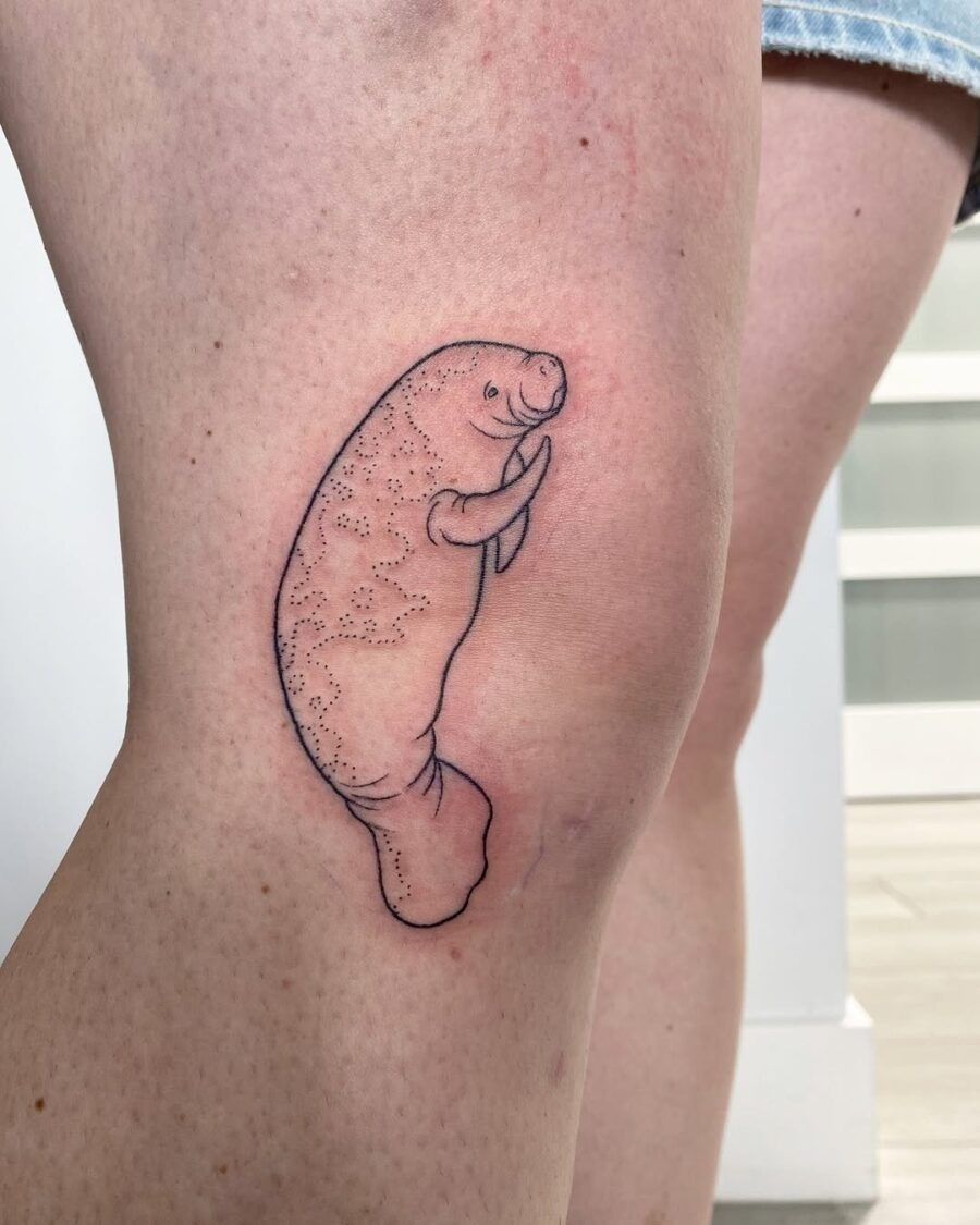 This manatee tattoo captures the adorable essence of these gentle giants.