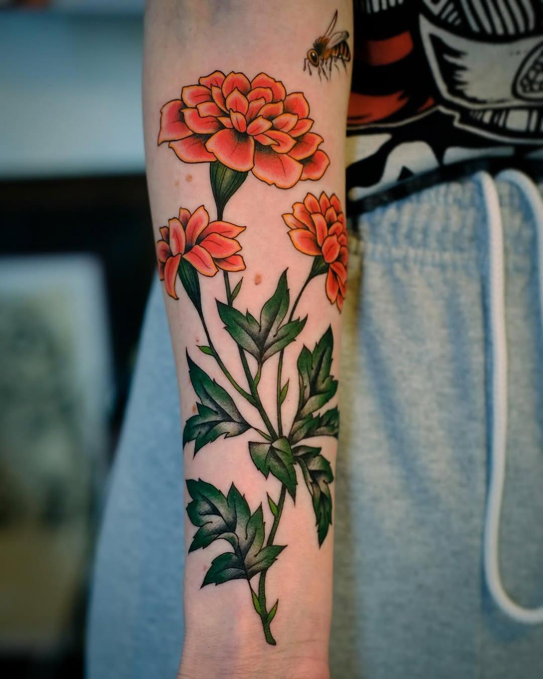 Beautiful marigold tattoos with vibrant colors Tattoo Design