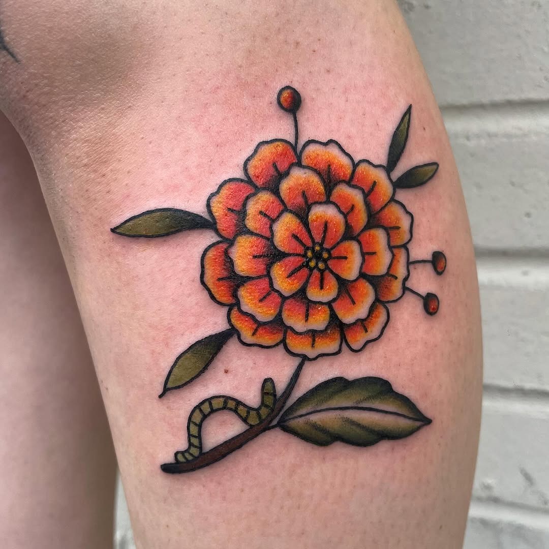 Bold marigold tattoo showcasing vibrant colors Tattoo Design