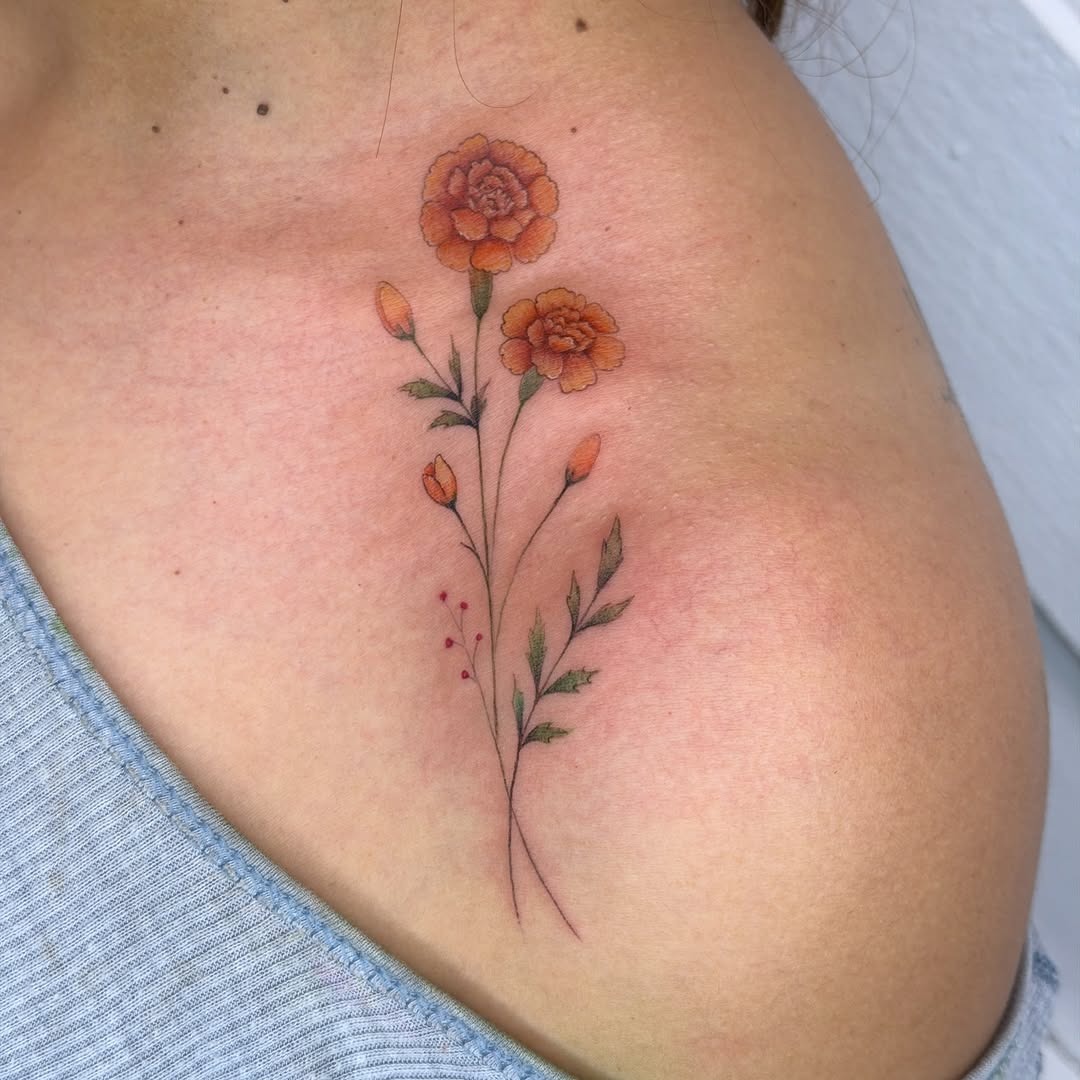 Elegant marigold tattoo exuding vibrant floral beauty Tattoo Design