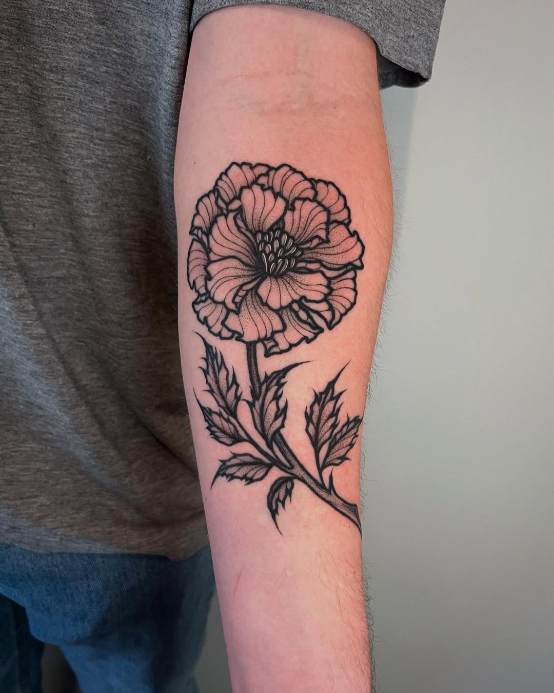 Elegant Marigold Tattoo in Black Ink Tattoo Design