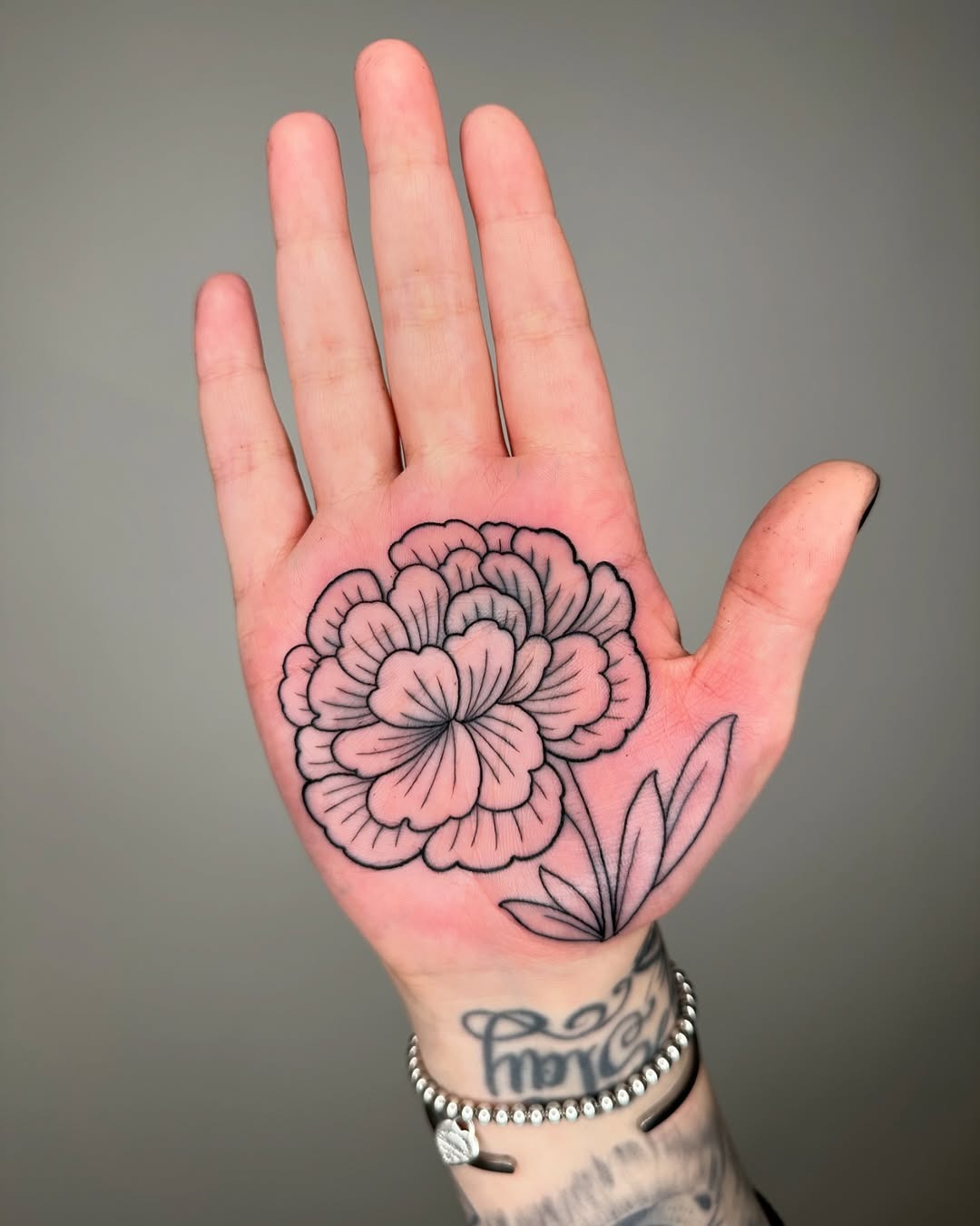 Elegant marigold tattoo on a palm design Tattoo Design