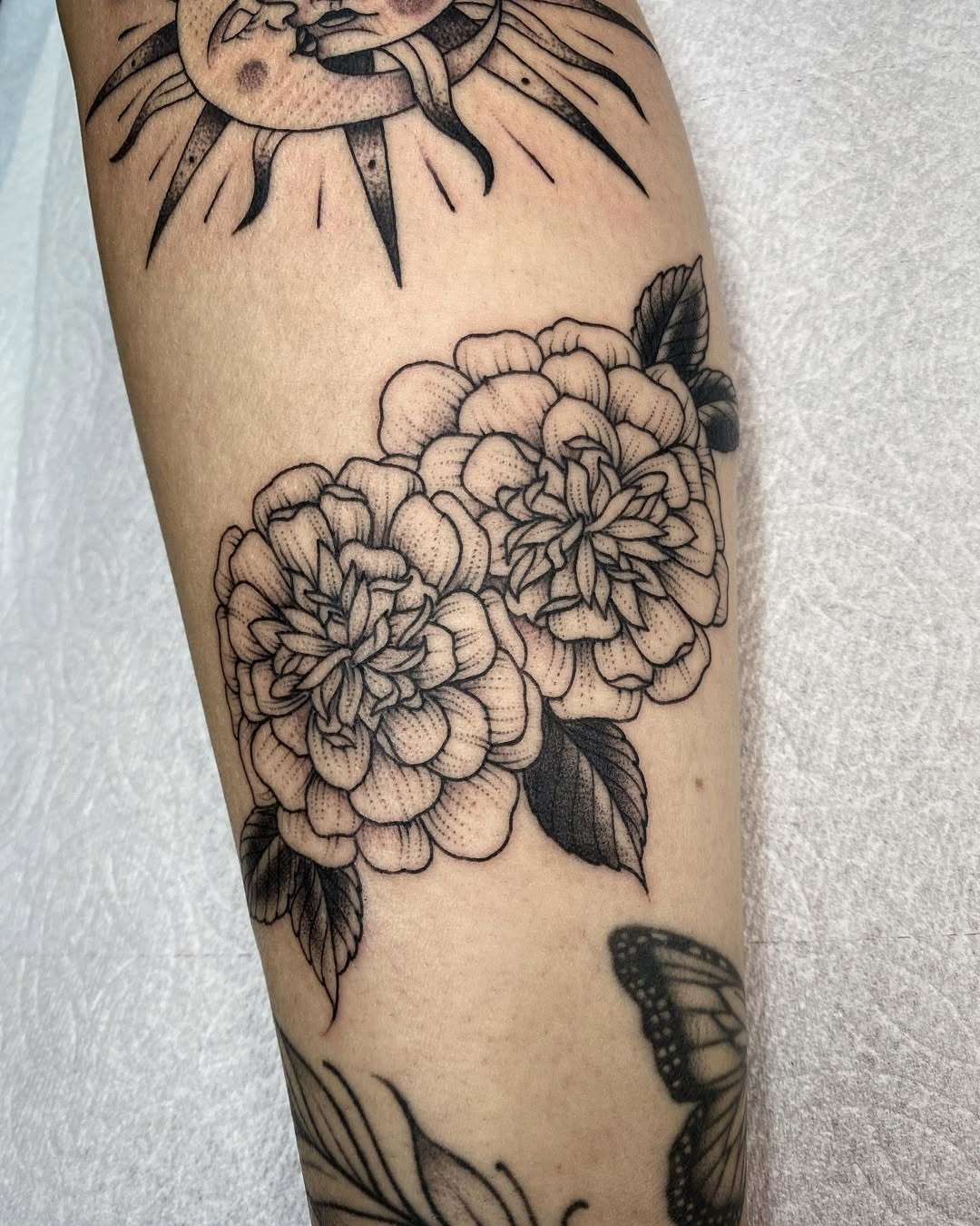 Elegant marigold tattoo with intricate detailing Tattoo Design