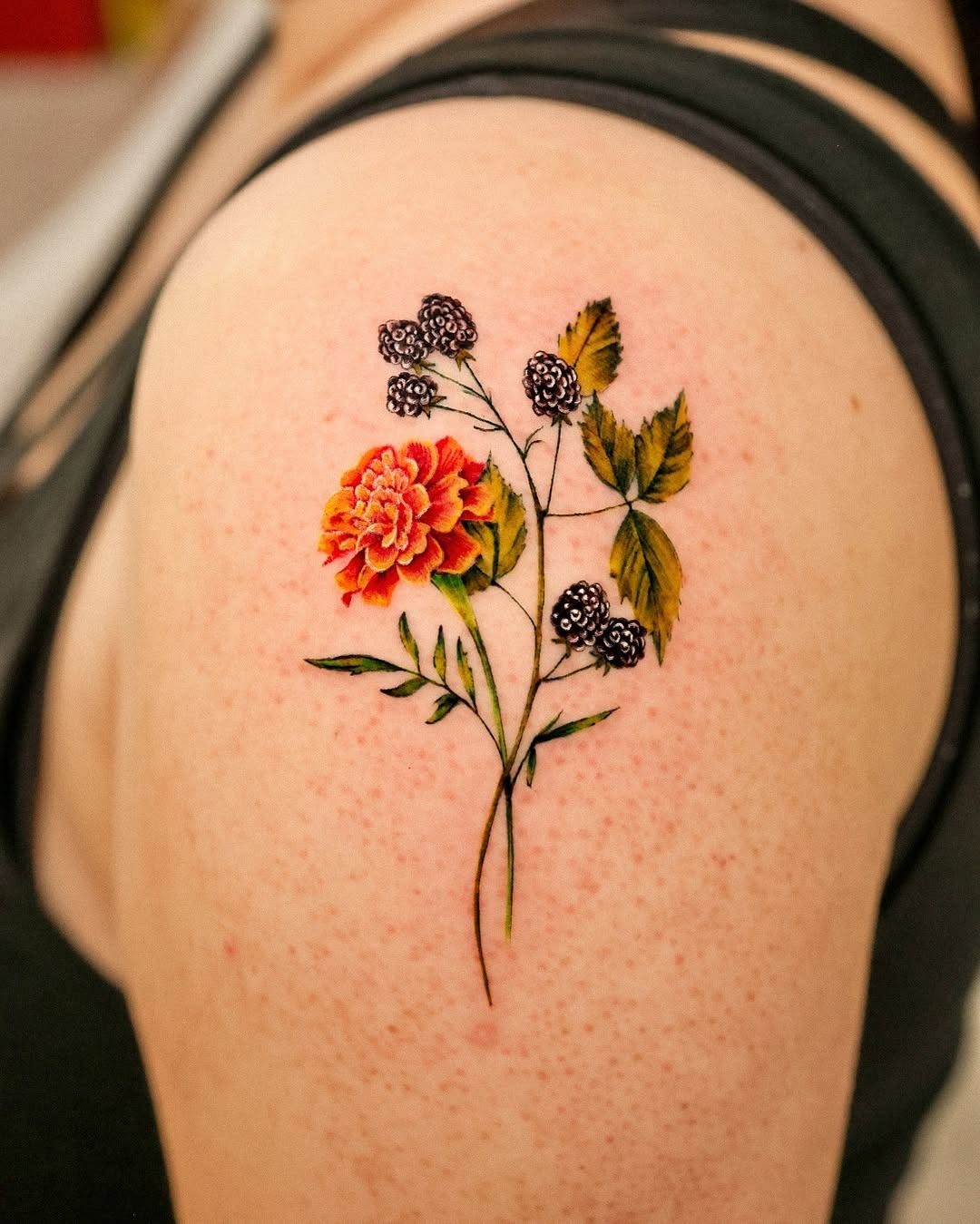 Radiant marigold tattoo showcasing vibrant colors Tattoo Design